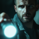 visual_flow_man_holding_a_flashlight_in_a_dark_room_close-up_--_ebee5d3a-339b-456c-ac42-7b6d9d954a94